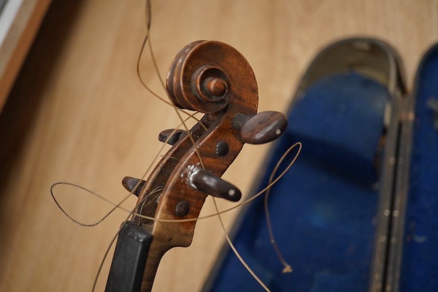 Two cased violins; one French 19th century bearing a hand written label for Francesco Werentle 1746, body length 35.5cm, the other an early 20th century violin, body length 35cm. Condition - poor.